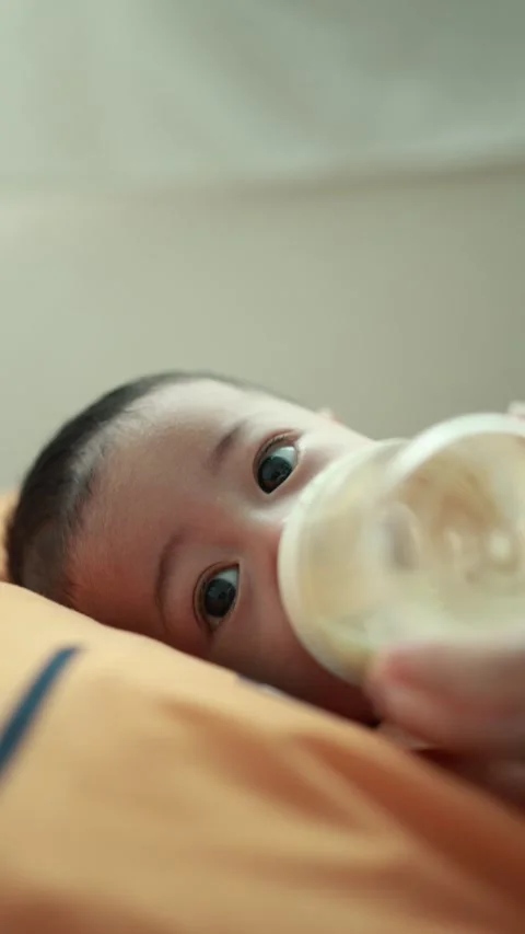 Closeup of a baby boy on the bed Stock Footage 333889510
