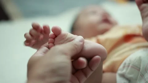 Closeup of a baby boy on the bed Stock Footage 333889514