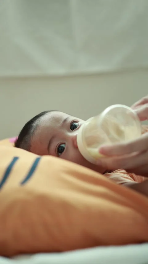 Closeup of a baby boy on the bed Stock Footage 333889516