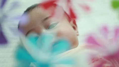 Closeup of a baby boy on the bed Stock Footage 333889529