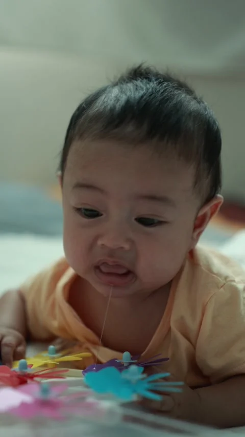 Closeup of a baby boy on the bed Stock Footage 333889557