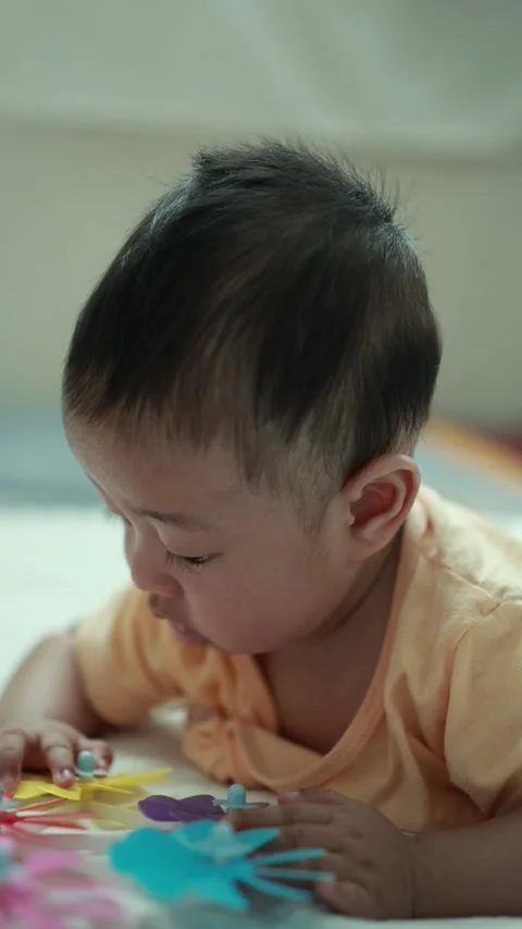 Closeup of a baby boy on the bed Stock Footage 333889562