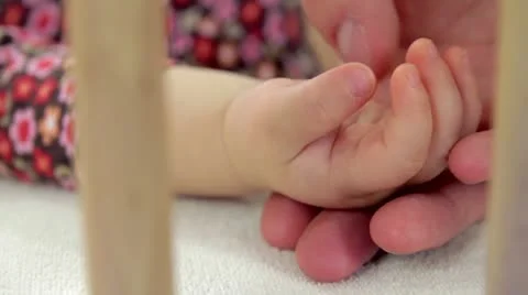 Closeup of baby's hand when his father touch it Video stock 22053687