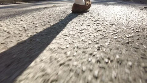 Closeup Back Of Mans Mocassin Shoes Walking On Gravel Pathway In Morning Wit Stock-Footage 251879595