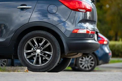 Closeup of back or rear side of cars parking in line parking area near stre.. Stock Photos