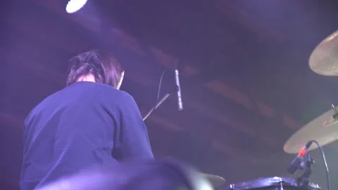 Closeup back view of joyful drummer having fun on rock concert. Footage Stockbeeldmateriaal 148195028