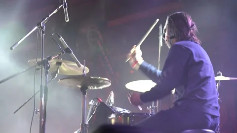 Closeup back view of joyful drummer having fun on rock concert. Footage Stockbeeldmateriaal 148196461