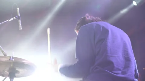 Closeup back view of joyful drummer having fun on rock concert. Footage Stockbeeldmateriaal 148475377