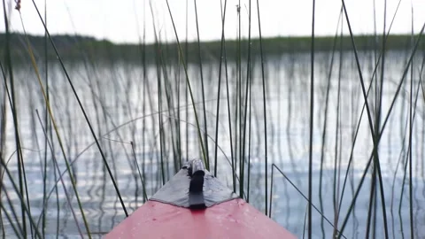 Closeup back view of the nose front part of a red kayak floating in the river Stock Footage 168478499