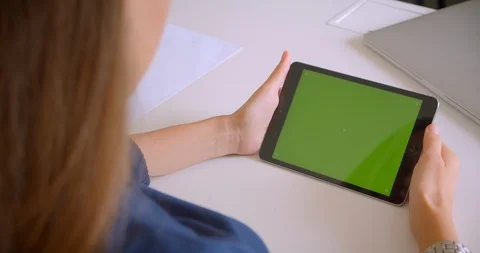 Closeup back view portrait of young attractive caucasian woman playing ad on Stock Footage 114186129