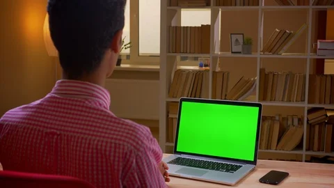 Closeup back view shoot of indian young businessman having a video call on the Stock Footage 108549372