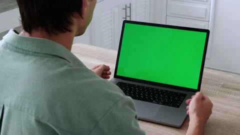 Closeup back view shoot of young business man having a video call on the laptop Stock Footage 200892061