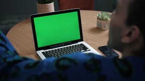 Closeup back view shot of young emotional man having a video call on the laptop Stock Footage 144492803