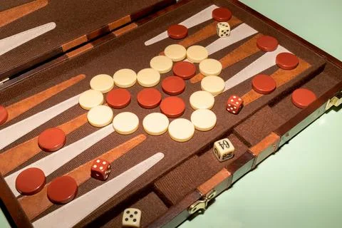 Closeup Backgammon Tables Game. Players Roll Dice, Rectangular Game Board Stock Photos