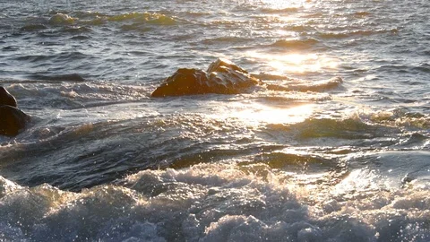 Closeup of backlight wave during a sunset moment Video stock 114569897