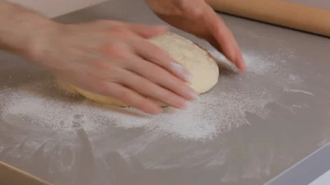 Closeup. Baker knead flour dough, roll it with a rolling pinю Baking concept. Video stock 101139312