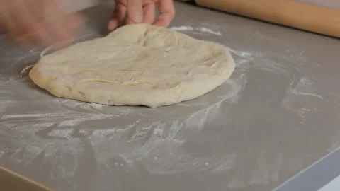 Closeup. Baker knead flour dough, roll it with a rolling pinю Baking concept. Video stock 101139868
