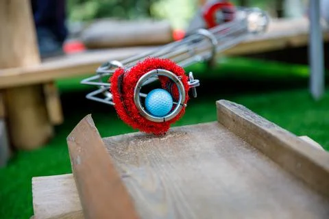Closeup of ball for playing mini golf with family. Families having fun with 스톡 사진