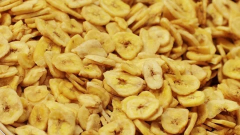 Closeup of Banana Chips shows crispy texture and tasty flavor, perfect for snack Stock Footage 279587857