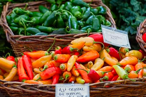 Closeup of baskets of peppers Stock Photos