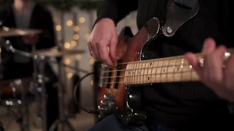CloseUp of Bass Player Hands Playing Rock Music with Bass Guitar at the Concert  Video stock 85391752