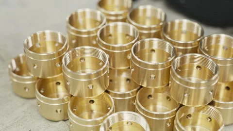 Closeup of batch of milled brass parts Stock Footage 264382128
