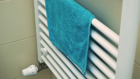 Closeup on bathroom heating with a towel over it 库存影片 79436052