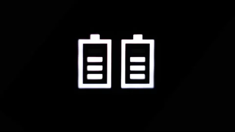 Closeup. Battery Charge Indicator in Darkness or Black Background. Charging Stock Footage 194800644