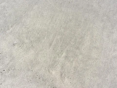 Closeup of beach sand texture background Stock Photos