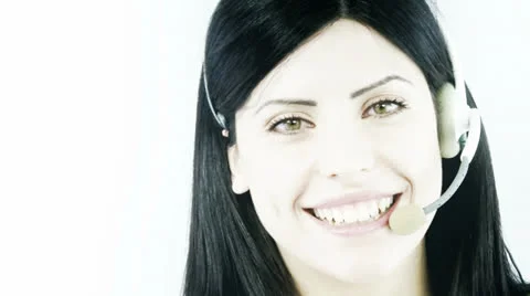 Closeup of beautiful business woman talking with headset smiling Stock Footage