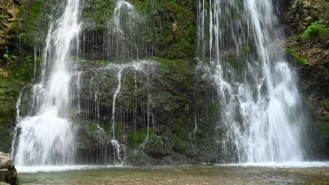Closeup of a beautiful twofold waterfall in a forest Video stock 260851745