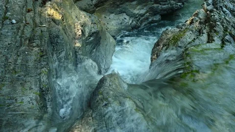 Closeup of a beautiful waterfall between stones of a rivulet in the mountains Stock Footage 211492059