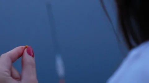 Closeup of beautiful womans hands preparing fishing bait Video stock 122955597