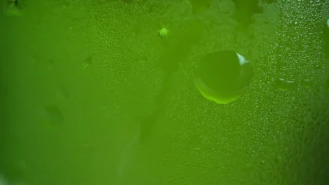 Closeup: beer bubbles floating up in the green beer bottle. Stock Footage 104060727
