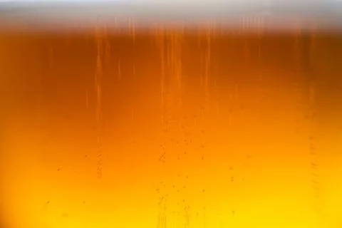 Closeup of a beer texture with bubbles and foam Stock Illustration