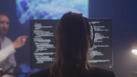 Closeup From Behind of a Female Data Analyst Working with a Team 스톡 동영상 208766703