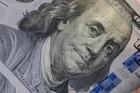 Closeup Benjamin Franklin face on one hundred US dollar banknote.-Image. Stock Photos