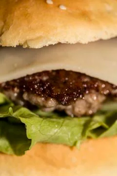 Closeup of big cheeseburger Stock Photos
