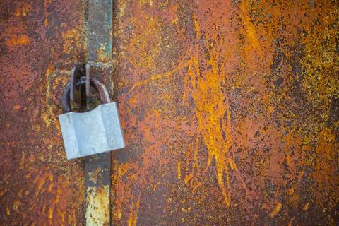 Closeup big lock on rustic wall Stock Photos