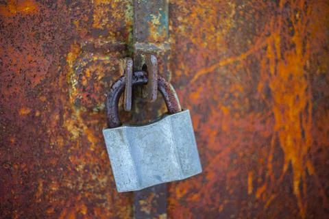 Closeup big lock on rustic wall Stock Photos