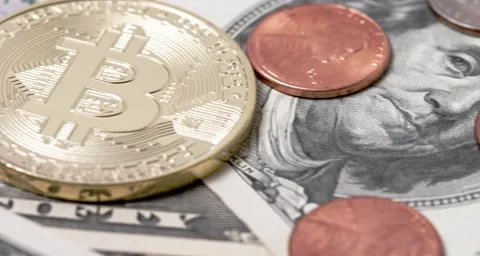 Closeup of Bitcoin and US Dollar banknotes and coins Stock Footage 158674447
