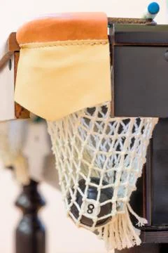 Closeup black billiard ball number 8 in the pocket Stock Photos