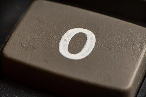 Closeup of a black calculator keypad button showing the number zero for Fotos Stock