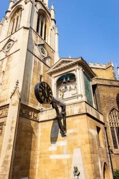 Closeup of a black clock hanging on the old building in London Stock Photos