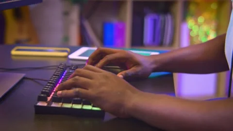 Closeup of a black man playing action video games on computer. Video stock 256167901