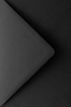 Closeup on a black paper envelope. Stock Photos