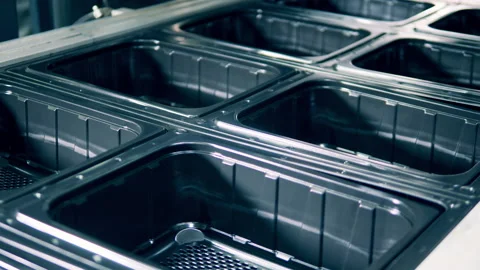 Closeup of black plastic containers molding process Video stock 145046447