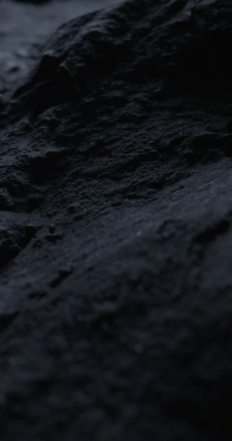Closeup of Black Stone Surface Background with Slow Probe Lens Push-In. Stock-Footage 348754881