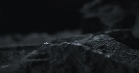 Closeup of Black Stone Surface Texture with Slow Probe Lens Push-In Vídeo Stock 348705905