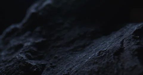 Closeup of Black Stone Surface Texture with Slow Probe Lens Push-In Vídeo Stock 348706163